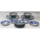 A pair of Chinese blue and white bowls, painted with a continuous landscape, 13cm diameter; a set of