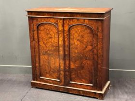 A Victorian burr walnut side cabinet with pair of arch panelled doors on a plinth base 107 x 103 x