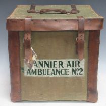 A canvas wrapped wicker basket adapted as bottle carrier, bound with copper nailed thick leather