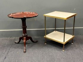 A small mahogany tripod table with pie crust top; together with a two tier brass lamp table (2)