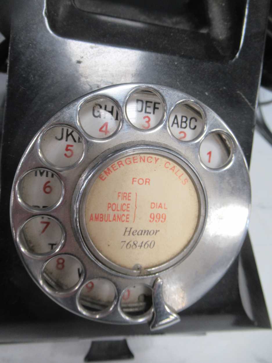 A bakelite desktop telephone with rotary dial and drawer to base, together with two carved wood - Image 4 of 4