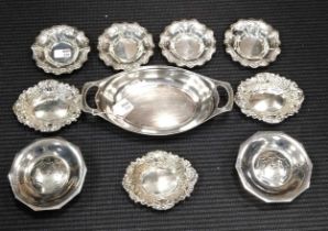 A collection of silverware including a set of 4 dishes, a set of 3 dishes, a pair of dishes, and a