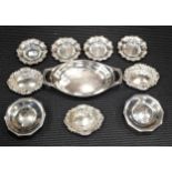 A collection of silverware including a set of 4 dishes, a set of 3 dishes, a pair of dishes, and a