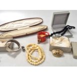 A collection of silver and costume jewellery including a base metal sovereign holder, a cameo brooch