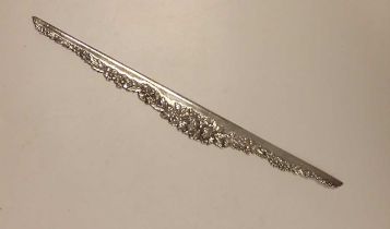 Kirk & Son, Baltimore - an American metalwares straight edge with foliate decoration, marked