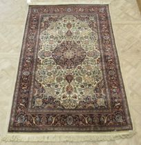 Two similar Kerman style rugs 200 x 125cm and 207 x 127cm (2)