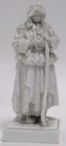 A fine quality Naples or Capodimonte blanc de chine figure of a woman with a staff, underglaze