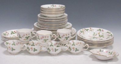 A Wedgwood wild strawberry dinner service for six Gilding around the rims is very worn, pattern is