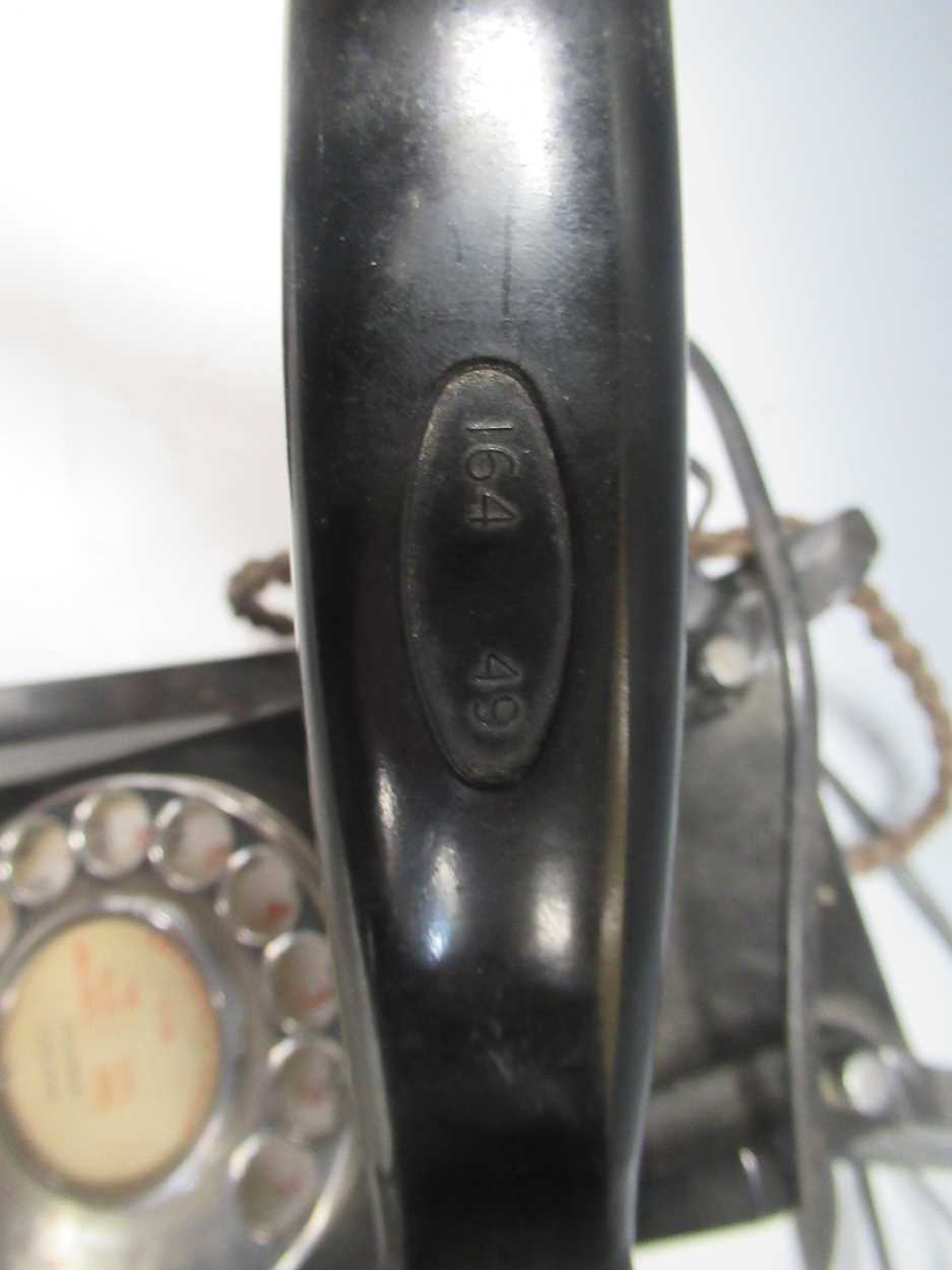 A bakelite desktop telephone with rotary dial and drawer to base, together with two carved wood - Image 2 of 4