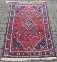 A Persian Tabriz type rug with central medallion 210 x 134cm