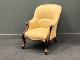 A Victorian walnut library armchair, with floral carved cabriole legs 90 x 67 x 63cm