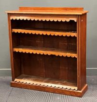 A late 19th century walnut open bookcase, the shelves with shaped and hinged dust protectors 126 x