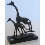 A bronzed metal model of two galloping giraffes, raised on plastic plinth base 30.5 x 23 x 9cm