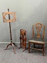 A George III style mahogany music stand on acanthus carved tripod base 149cm high together with a