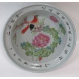 A Chinese Republic period bowl, the centre painted with a bird and inscribed around the rim with a