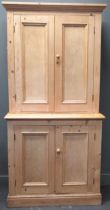 A large pine cupboard with plinth base 215 x 105 x 50cm The top can be separated from the base, into