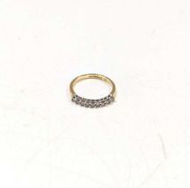 A hallmarked 18ct gold diamond set half hoop syle ring, estimated approximate total diamond weight