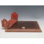 An embossed leather desk blotter; book stand: and two souvenir shell sailors valentines in anchor