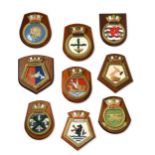 A collection of ship's badges,