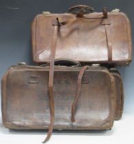 A late 19th century leather expanding valise with canvas lined divided interior, stamped and