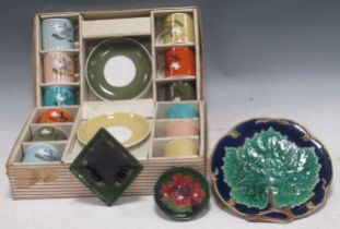 Three shaped Moorcroft china dishes, and 12 Susie Cooper tea cups and saucers in two fitted boxes,