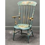 An early 20th century painted comb back armchair with floral decoration Wear to the paint consistent