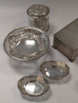 A collection of silverware including a cylindrical dressing table box, a table cigarette box, two