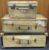 Two 20th century travelling vellum or hide suitcase, compactum or steamer trunks by Whatjoy.