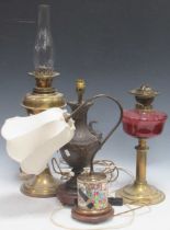 Two Victorian brass oil lamps, together with a bronzed vase shape lamp base and a Chinese famille