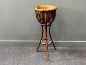 An early 20th century bentwood jardiniere with brass liner 90 x 36cm together with an early 19th