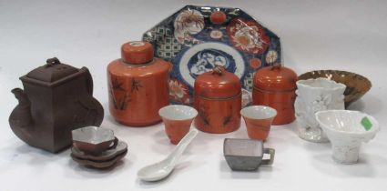 A Chinese red stoneware teapot and cover, three orange ground cannisters and covers. an imari