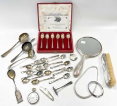 A collection of silverware including a silver backed brush and hand mirror, flatware, necklace and