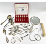A collection of silverware including a silver backed brush and hand mirror, flatware, necklace and