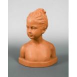 A Goldscheider terracotta bust of a young female nude,