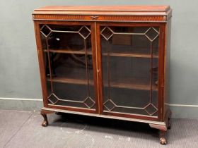 An Edwardian mahogany two door glazed cabinet with claw and ball feet 119 x 122 x 31cm