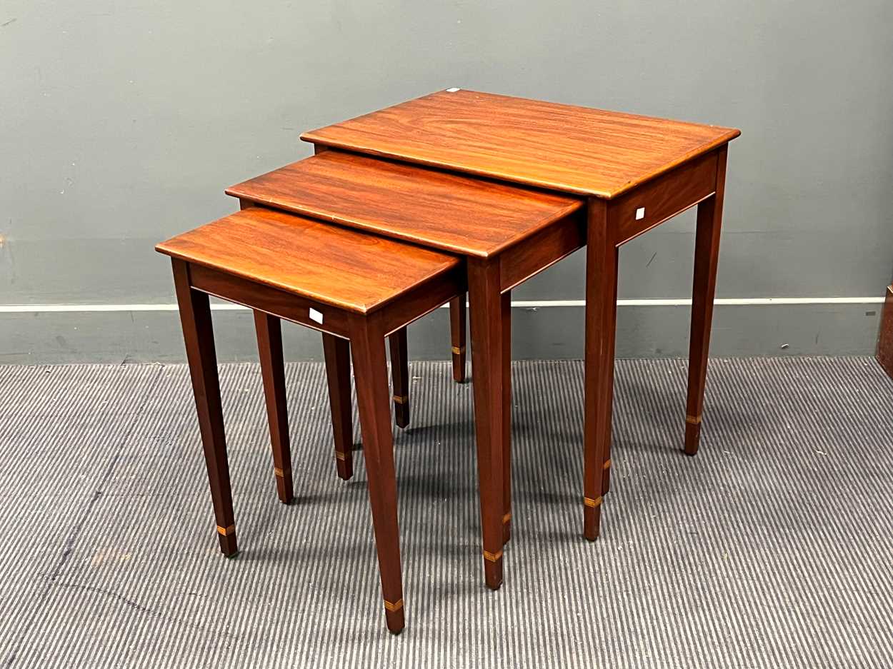 A nest of three mahogany rectangular tables, modern, on square tapering legs Largest: 64 x 64 x