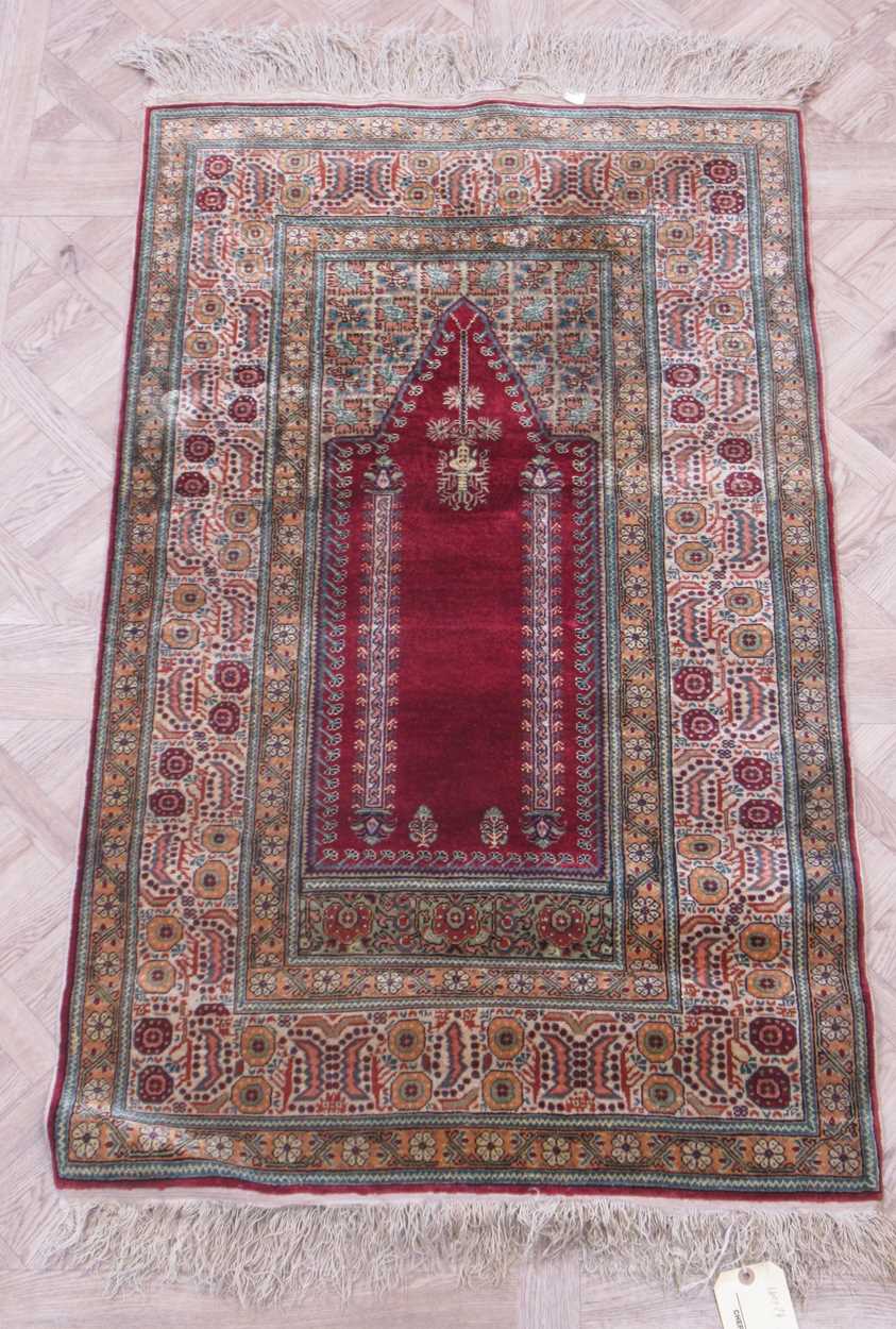 A vintage 'silk' prayer rug 140 x 74cm