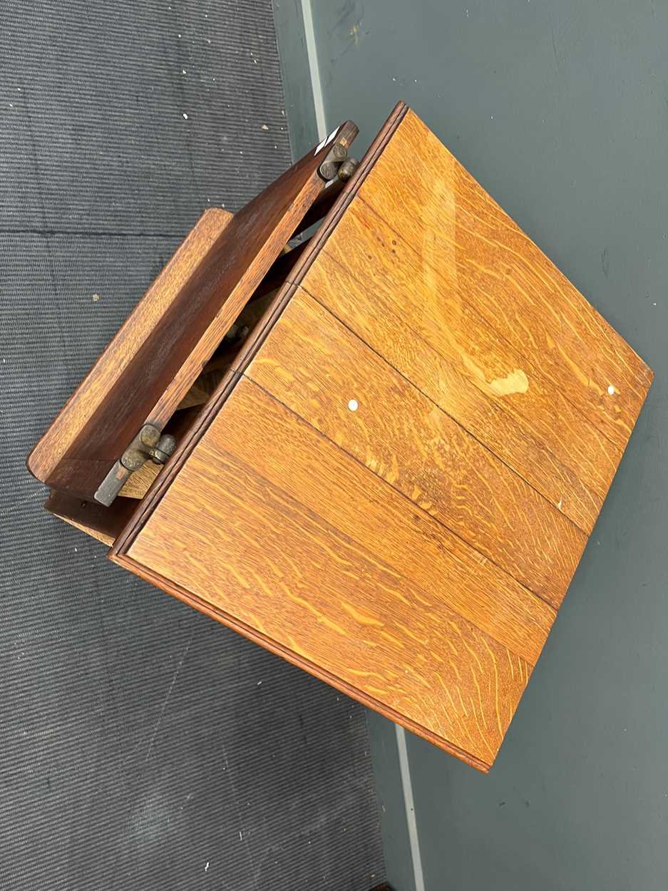 An early 20th century oak revolving bookcase, with an adjustable book rest, on castors 91 x 54 x - Image 2 of 3