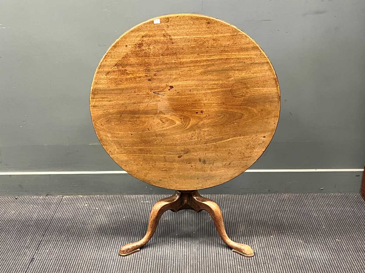 A George III mahogany circular occasional table, on turned column and pad feet 62 x 79cm; another