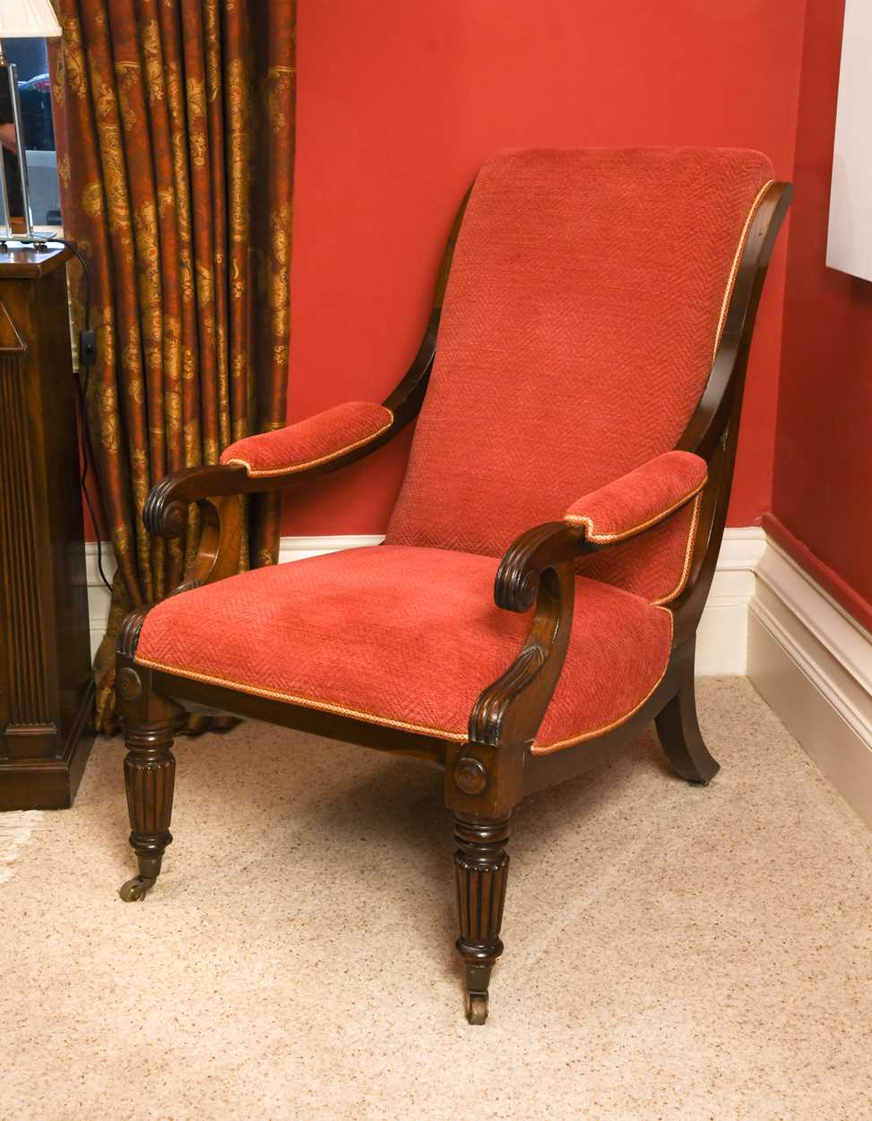 A Regency mahogany frame scroll arm easy chair,