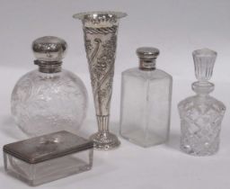 A silver mounted glass dressing table bottle, the glass etched with a spider in a web, together with