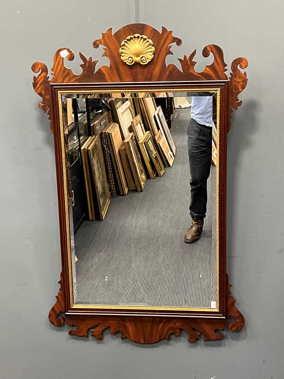 An American made Georgian style reproduction mahogany fretwork frame wall mirror, with gilt