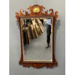 An American made Georgian style reproduction mahogany fretwork frame wall mirror, with gilt
