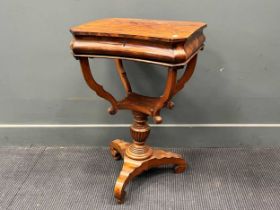 A 19th century walnut work table, the hinged lid enclosing a fitted interior with compartments 75