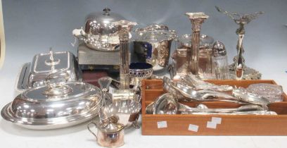 A collection of silver plated ware to include entree dishes, muffin dish, a pair of candlesticks,