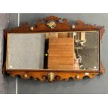 A George II style mahogany and parcel gilt shaped rectangular wall mirror, 83 x 127cm