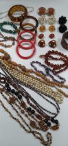 Two freshwater cultured pearl necklaces, and a large collection of beads and costume jewellery