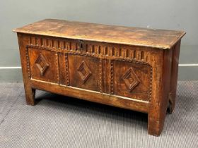 An early 18th century oak coffer, with three diamond motif 57 x 107 x 40cm