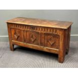 An early 18th century oak coffer, with three diamond motif 57 x 107 x 40cm