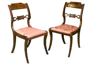 A pair of Regency rosewood dining chairs,
